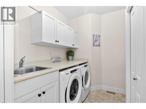 Laundry room off the garage at 13155 Staccato Drive, Lake Country North West
