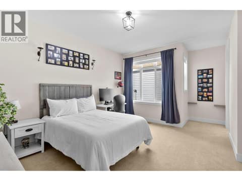 Primary bedroom with walk-in closet at 13155 Staccato Drive, Lake Country North West