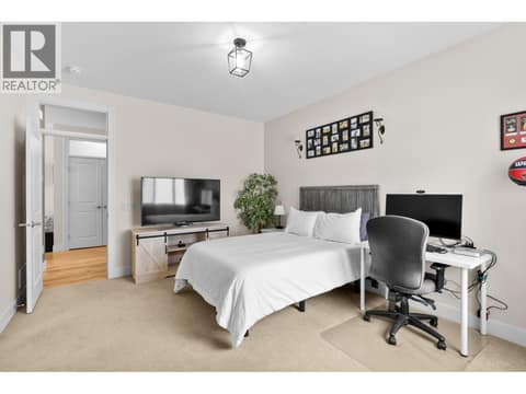 Primary bedroom with walk-in closet at 13155 Staccato Drive, Lake Country North West