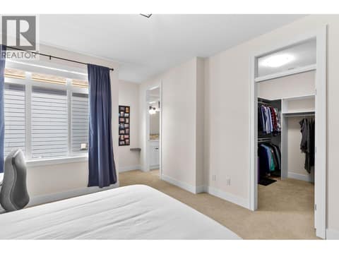 Primary bedroom with walk-in closet at 13155 Staccato Drive, Lake Country North West