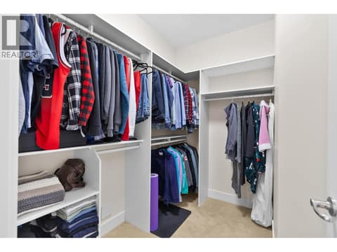 Primary bedroom with walk-in closet at 13155 Staccato Drive, Lake Country North West