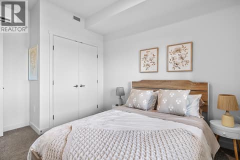 Bedroom. Photos are of a similar home; some features may vary at 1111 Frost Road Unit# 403, Upper Mission, Kelowna