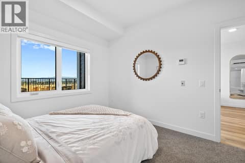 Bedroom. Photos are of a similar home; some features may vary at 1111 Frost Road Unit# 403, Upper Mission, Kelowna