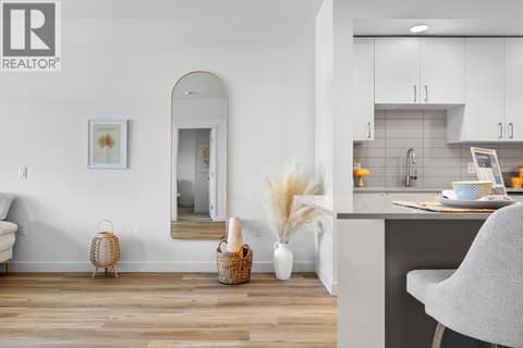 Kitchen and Living Room. Photos are of a similar home; some features may vary at 1111 Frost Road Unit# 403, Upper Mission, Kelowna
