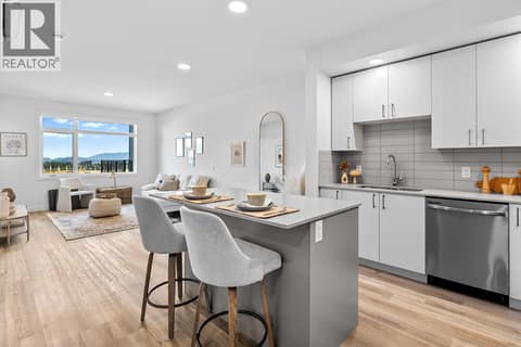 Kitchen and Living Room. Photos are of a similar home; some features may vary at 1111 Frost Road Unit# 403, Upper Mission, Kelowna
