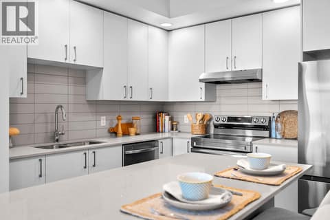 Kitchen. Photos are of a similar home; some features may vary at 1111 Frost Road Unit# 403, Upper Mission, Kelowna