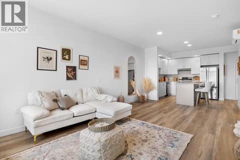 Living Room and Kitchen. Photos are of a similar home; some features may vary at 1111 Frost Road Unit# 403, Upper Mission, Kelowna