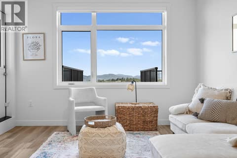 Living Room. Photos are of a similar home; some features may vary at 1111 Frost Road Unit# 403, Upper Mission, Kelowna