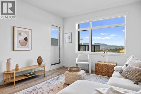 Living Room. Photos are of a similar home; some features may vary at 1111 Frost Road Unit# 403, Upper Mission, Kelowna