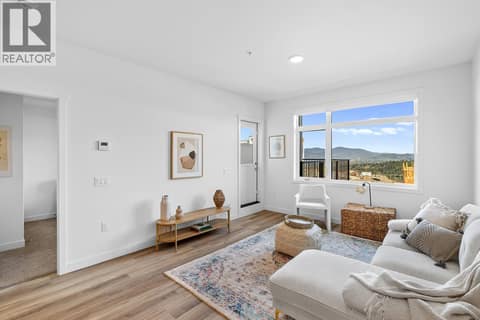 Living Room. Photos are of a similar home; some features may vary at 1111 Frost Road Unit# 403, Upper Mission, Kelowna