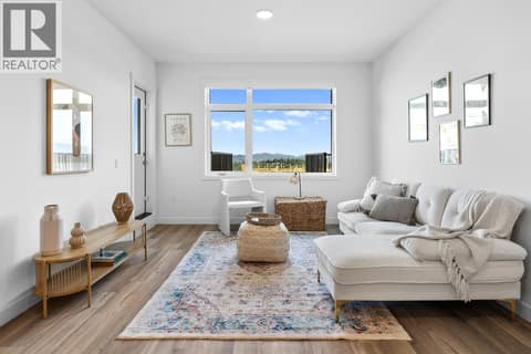 Living Room. Photos are of a similar home; some features may vary at 1111 Frost Road Unit# 403, Upper Mission, Kelowna