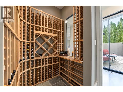 Glassed feature cooled wine room on main to show your prizes and enjoy at 3673 Green Bay Landing, Lakeview Heights, West Kelowna