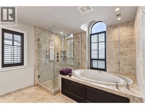 Luxurious ensuite with ceiling faucet to soaker tub and shower with body jets at 3673 Green Bay Landing, Lakeview Heights, West Kelowna