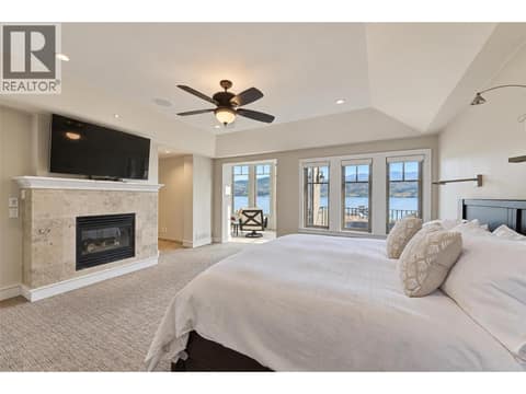 Primary Bedroom suite is a destination and a dream - gas fireplace at 3673 Green Bay Landing, Lakeview Heights, West Kelowna