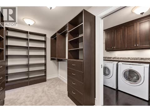 Primary bedroom Walk in closet connects to laundry at 3673 Green Bay Landing, Lakeview Heights, West Kelowna