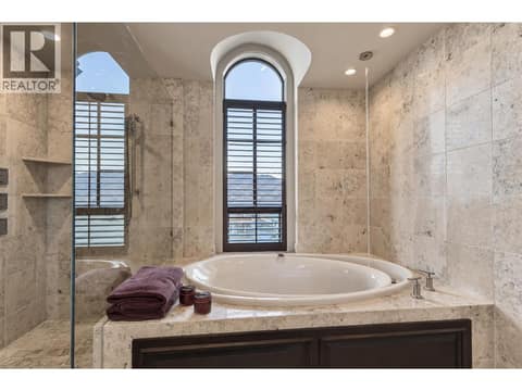 Soaker tub with view windows to lake at 3673 Green Bay Landing, Lakeview Heights, West Kelowna