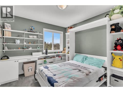 Bed 1 upstairs with murphy bed and built in shelving at 3819 Glen Canyon Drive, Westbank Centre, West Kelowna