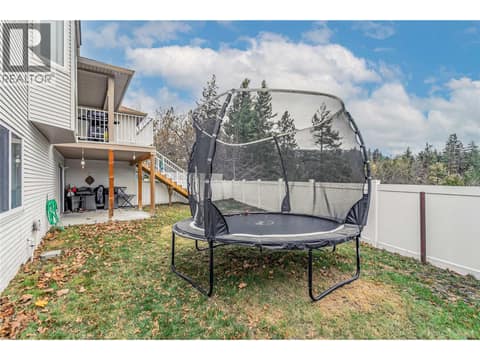 Large, fully fenced yard at 3819 Glen Canyon Drive, Westbank Centre, West Kelowna