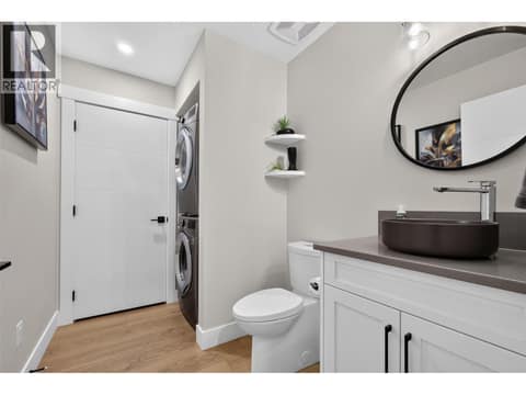 With laundry combined with a half bathroom at 3555 Boxwood Road, McKinley Landing, Kelowna