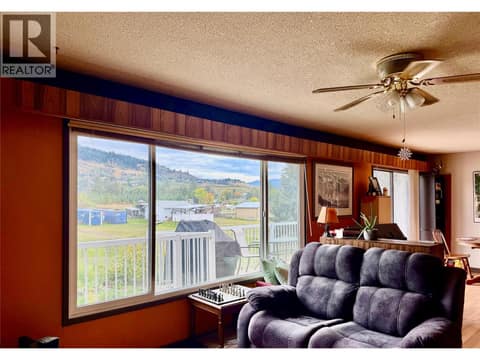 Main floor living room with a view over your property at 2271 Francis Street, South BX, Vernon