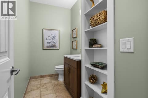 Main floor powder with fresh paint and storage. at 2283 Shannon Heights Court Unit# 6, Shannon Lake, West Kelowna