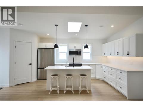 Expanded and upgraded kitchen with skylight at 12204 Westside Road Unit# 200, Okanagan North, Vernon