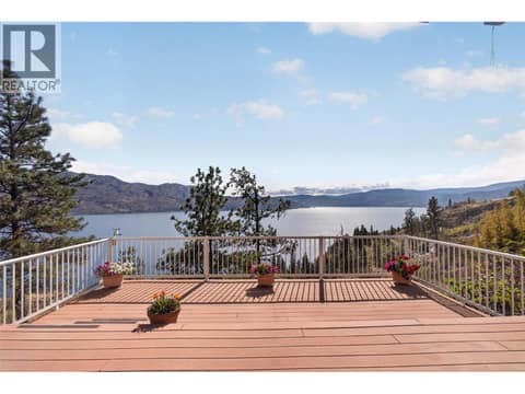 A front-row seat to Okanagan Lake — an expansive deck made for soaking in the panoramic views at 3040 Seclusion Bay Road, Westbank Centre, West Kelowna