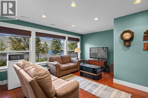 Enjoy movie night down here in style with lake views on all three levels. at 2620 Arthur Road, McKinley Landing, Kelowna