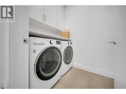 Laundry on upper level with cabinets for extra storage at 2100 Campbell Place Unit# 154, Lakeview Heights, West Kelowna