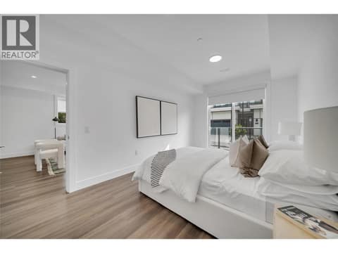 Lower level bedroom to family room at 2100 Campbell Place Unit# 154, Lakeview Heights, West Kelowna