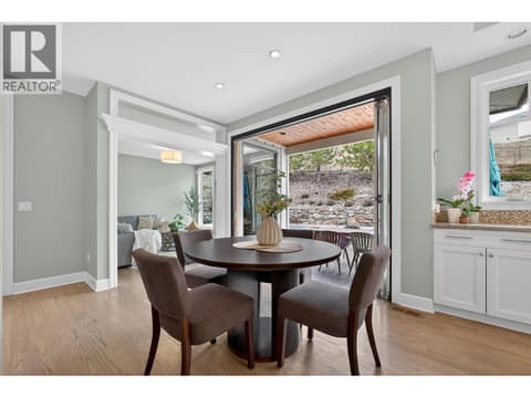 Folding glass patio doors open up into the backyard at 1996 Twin Ridge Court, Wilden, Kelowna