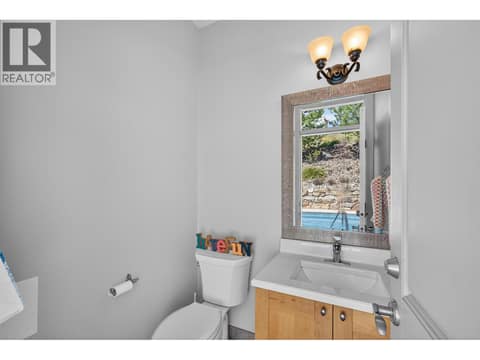 Half bath by the pool deck at 1996 Twin Ridge Court, Wilden, Kelowna