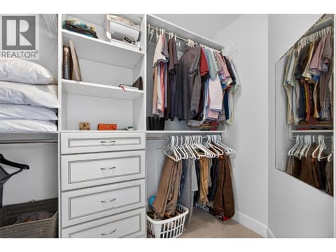 His closet at 1996 Twin Ridge Court, Wilden, Kelowna