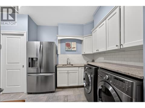 Laundry/mud room with access to the garage at 1996 Twin Ridge Court, Wilden, Kelowna