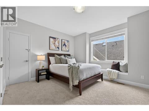 Second bedroom on the upper level with access to attic at 1996 Twin Ridge Court, Wilden, Kelowna