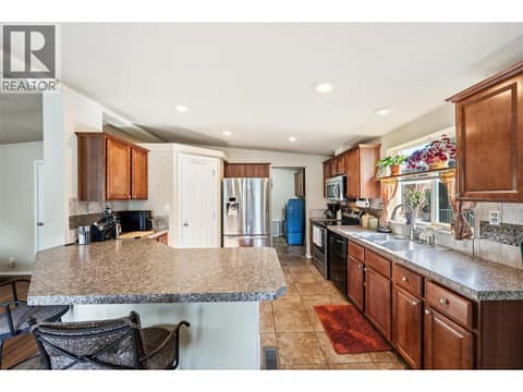Kitchen. at 8712 Steuart Street Unit# 54, Summerland Rural