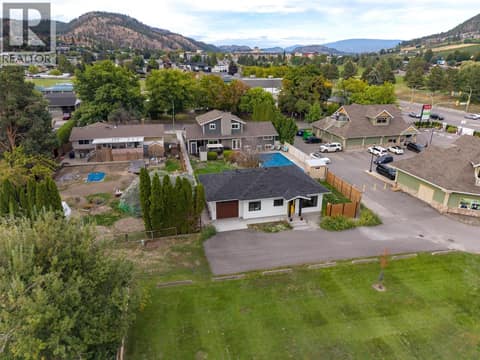 Carriage homes off lane fronts onto quiet neighborhood park with playset. at 1859-1861 Mountain Avenue, Glenmore, Kelowna