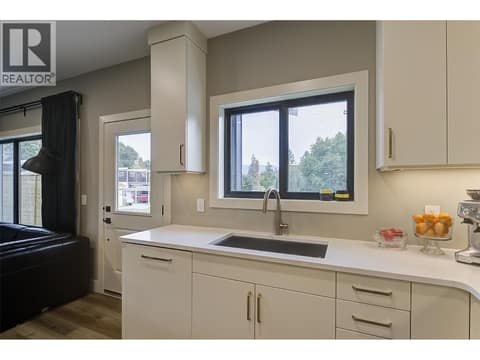 Carriage - upscale kitchen, southern window over sink to park at 1859-1861 Mountain Avenue, Glenmore, Kelowna