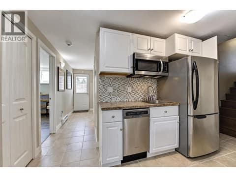 Full size fridge plus dishwasher (no stove) at 1859-1861 Mountain Avenue, Glenmore, Kelowna