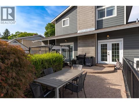Patio area with room for outdoor eating and living at 1859-1861 Mountain Avenue, Glenmore, Kelowna