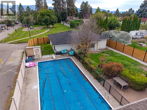 Pool, Carriage home with lane access backing overlooking  Calmels Park. at 1859-1861 Mountain Avenue, Glenmore, Kelowna