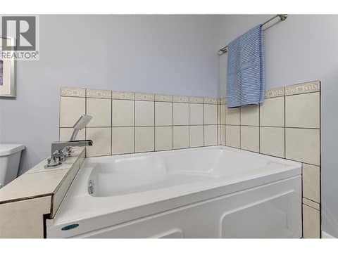 Soaker tub with tile surround at 1859-1861 Mountain Avenue, Glenmore, Kelowna