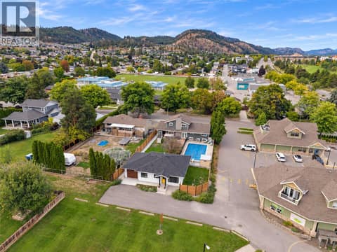 Steps to Glemore Elementary School- Circle K corner store, Golf and Country Club, Transit- so central! at 1859-1861 Mountain Avenue, Glenmore, Kelowna