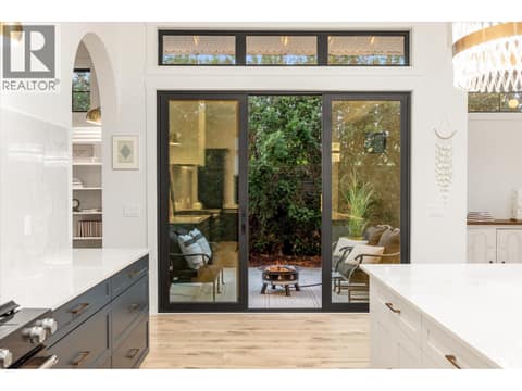 Access to shaded side patio off the kitchen at 2053 Long Street, Kelowna South
