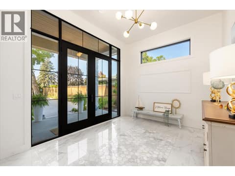 Foyer with custom marble inlay at 2053 Long Street, Kelowna South