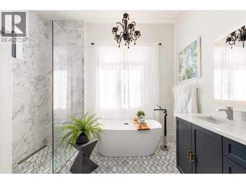 Heated marble flooring featured throughout all the bathrooms in the home at 2053 Long Street, Kelowna South