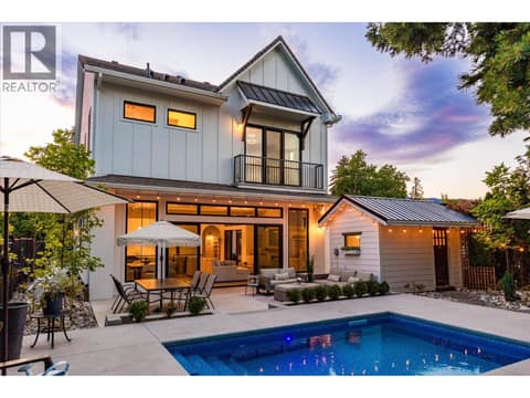 Main living area opens to private backyard oasis at 2053 Long Street, Kelowna South