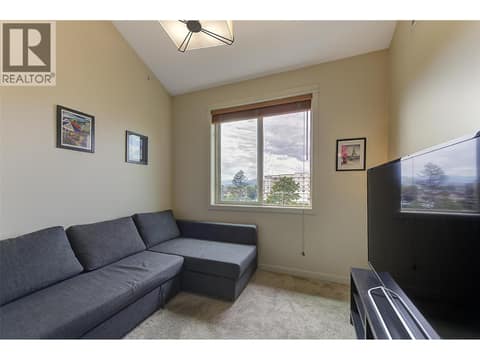 Main floor Bedroom or Den (just nees an armoire for a bedroom) at 2142 Vasile Road Unit# #409, Springfield/Spall, Kelowna