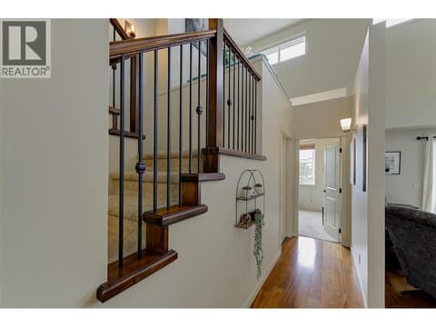 Open staircase and plan with soaring ceilings at 2142 Vasile Road Unit# #409, Springfield/Spall, Kelowna