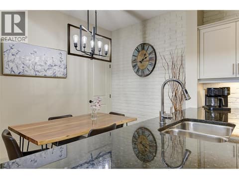 Quartz counters offer tons of cooking space and eating area at 2142 Vasile Road Unit# #409, Springfield/Spall, Kelowna
